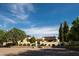 Luxurious estate showcasing grand architecture, lush landscaping, and gated entry under a bright blue sky at 7525 N Shadow Mountain Rd, Paradise Valley, AZ 85253