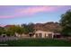 Lovely home exterior with meticulously maintained lawn, mountain views, and tranquil landscaping at 7525 N Shadow Mountain Rd, Paradise Valley, AZ 85253