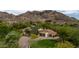 Expansive estate featuring lush landscaping, circular driveway, and mountain views at 7525 N Shadow Mountain Rd, Paradise Valley, AZ 85253