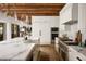 Bright kitchen featuring a marble-topped island, stainless steel appliances, and custom cabinets at 7525 N Shadow Mountain Rd, Paradise Valley, AZ 85253