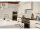 Well-equipped kitchen with marble countertops, stainless steel appliances, and custom cabinetry at 7525 N Shadow Mountain Rd, Paradise Valley, AZ 85253