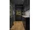 Elegant kitchen with dark custom cabinets, brass hardware, and built-in refrigerator at 7525 N Shadow Mountain Rd, Paradise Valley, AZ 85253