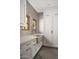 Laundry room features a utility sink, brick backsplash, and white shaker cabinets at 7525 N Shadow Mountain Rd, Paradise Valley, AZ 85253