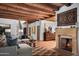 Spacious living room featuring wood floors, fireplace, and staircase at 7525 N Shadow Mountain Rd, Paradise Valley, AZ 85253