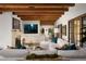 Bright living room featuring wood beam ceilings, fireplace, and a comfortable white sectional at 7525 N Shadow Mountain Rd, Paradise Valley, AZ 85253