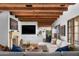 Open-concept living room featuring wood floors, fireplace, and comfortable seating at 7525 N Shadow Mountain Rd, Paradise Valley, AZ 85253
