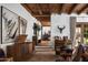 Inviting living room featuring wood beam ceilings, hardwood floors, and stylish decor at 7525 N Shadow Mountain Rd, Paradise Valley, AZ 85253