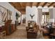 Inviting living room featuring exposed wood beams, leather chairs, and stylish decor at 7525 N Shadow Mountain Rd, Paradise Valley, AZ 85253