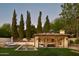 This property features a pool, a beautiful yard, mature trees, and an outdoor kitchen with seating at 7525 N Shadow Mountain Rd, Paradise Valley, AZ 85253