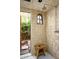 Tiled shower featuring a window and view of the greenery outside at 7525 N Shadow Mountain Rd, Paradise Valley, AZ 85253