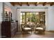 Cozy sitting area with carved cabinet and large window with backyard views at 7525 N Shadow Mountain Rd, Paradise Valley, AZ 85253
