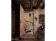 Stone wine cellar entrance with wooden door and rustic details at 7525 N Shadow Mountain Rd, Paradise Valley, AZ 85253