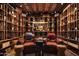 Climate-controlled wine cellar with custom storage and comfortable seating at 7525 N Shadow Mountain Rd, Paradise Valley, AZ 85253