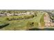 Panoramic aerial view of a golf course community with lush green fairways and manicured landscaping at 7834 E Mariposa E Way, Mesa, AZ 85208