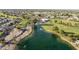 Overhead view of a community with a pond, golf course, fountain and mature trees at 7834 E Mariposa E Way, Mesa, AZ 85208