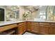 Bathroom vanity with double vessel sinks, wood cabinets and a countertop with decor at 7834 E Mariposa E Way, Mesa, AZ 85208
