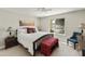 Bright bedroom with a large bed, side tables and lamps, and a window overlooking the exterior at 7834 E Mariposa Way, Mesa, AZ 85208