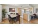 Inviting dining area with a table, chandelier, and seamless transition to the kitchen for easy entertaining at 7834 E Mariposa Way, Mesa, AZ 85208