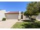 Charming single-story home with a red tile roof, a two-car garage, and a well-manicured front yard at 7834 E Mariposa Way, Mesa, AZ 85208