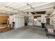 Spacious garage with ample storage cabinets, laundry, work bench and seating at 7834 E Mariposa E Way, Mesa, AZ 85208