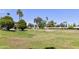 Lush golf course with mature trees in a desirable community with beautiful landscaping at 7834 E Mariposa Way, Mesa, AZ 85208