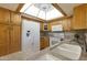 Well-lit kitchen features white appliances, a granite countertop, and a functional layout for meal preparation at 7834 E Mariposa E Way, Mesa, AZ 85208