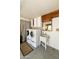 Laundry room with full-size washer and dryer, a sink, and cabinets at 7834 E Mariposa Way, Mesa, AZ 85208