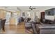 Spacious living room with hardwood floors and modern furniture, offering ample seating and natural light at 7834 E Mariposa Way, Mesa, AZ 85208