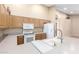Well-lit kitchen featuring white appliances, ample counter space, and a breakfast bar at 7966 W Surrey Ave, Peoria, AZ 85381