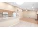 Bright and open kitchen layout with breakfast bar and an easy view into the living room at 7966 W Surrey Ave, Peoria, AZ 85381