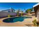 This private pool is fenced, and part of a desert landscaped backyard at 7966 W Surrey Ave, Peoria, AZ 85381