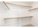 Walk-in closet with shelves and rods for storage, providing ample space at 7966 W Surrey Ave, Peoria, AZ 85381
