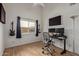 Bedroom with natural light, wood floor, and guitars on the wall at 821 E Chicago St, Chandler, AZ 85225