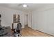This bedroom features wood-look floors, a closet, ceiling fan and modern art at 821 E Chicago St, Chandler, AZ 85225