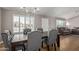 Cozy dining room with wood-look floors, natural light, and neutral wall paint at 821 E Chicago St, Chandler, AZ 85225