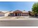 Charming single-story home featuring a tile roof, neutral tones, a two-car garage, and desert landscaping at 821 E Chicago St, Chandler, AZ 85225