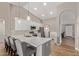 Bright kitchen features stainless steel appliances, a breakfast bar, and wood-look flooring at 821 E Chicago St, Chandler, AZ 85225