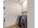 Laundry room with newer appliances, cabinet, and access to exterior at 821 E Chicago St, Chandler, AZ 85225