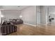 Cozy living room with wood-look floors, neutral walls, modern lighting, and a comfortable sofa at 821 E Chicago St, Chandler, AZ 85225