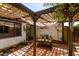 Back patio featuring a table and chairs and view of the house at 930 E Page St, Gilbert, AZ 85234