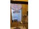 Tiled bathroom with stained glass window and built-in shower niche at 930 E Page St, Gilbert, AZ 85234