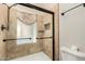 Modern bathroom features a glass-enclosed shower with elegant tile work and fixtures at 930 E Page St, Gilbert, AZ 85234