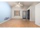 Spacious bedroom boasts vaulted ceiling, a ceiling fan, and wood-look laminate flooring at 930 E Page St, Gilbert, AZ 85234