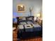 Bedroom with a comfortable bed, decorative lamps, and cozy ambiance at 930 E Page St, Gilbert, AZ 85234