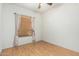 Cozy bedroom with wood-look laminate flooring, window coverings, and ample natural light at 930 E Page St, Gilbert, AZ 85234