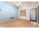 Bedroom with ceiling fan, natural light, and wood-look laminate flooring at 930 E Page St, Gilbert, AZ 85234