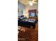 Cozy bedroom with comfortable bed, ceiling fan, and decorative rug at 930 E Page St, Gilbert, AZ 85234