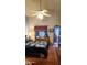 Bedroom featuring a large window, ceiling fan, and comfortable bed at 930 E Page St, Gilbert, AZ 85234