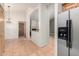 Hallway with tile flooring leads to multiple rooms, showing the home's open floor plan at 930 E Page St, Gilbert, AZ 85234