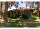 Charming brick home with well-maintained lawn and mature trees providing shade and curb appeal at 930 E Page St, Gilbert, AZ 85234